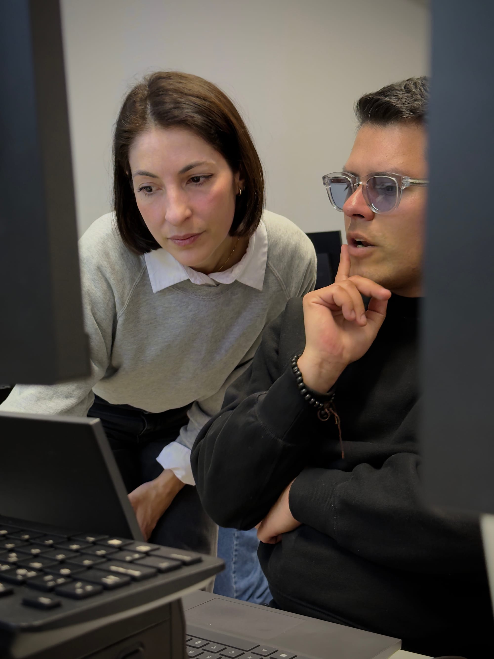 Alba Estevez reviewing a student's work at the screen